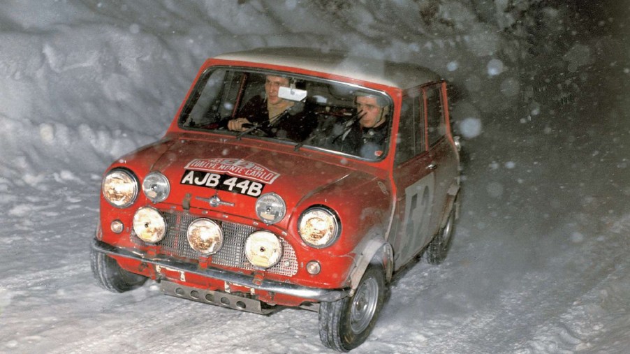 Red 1965 Mini Cooper S racing in the snow at Monte Carlo
