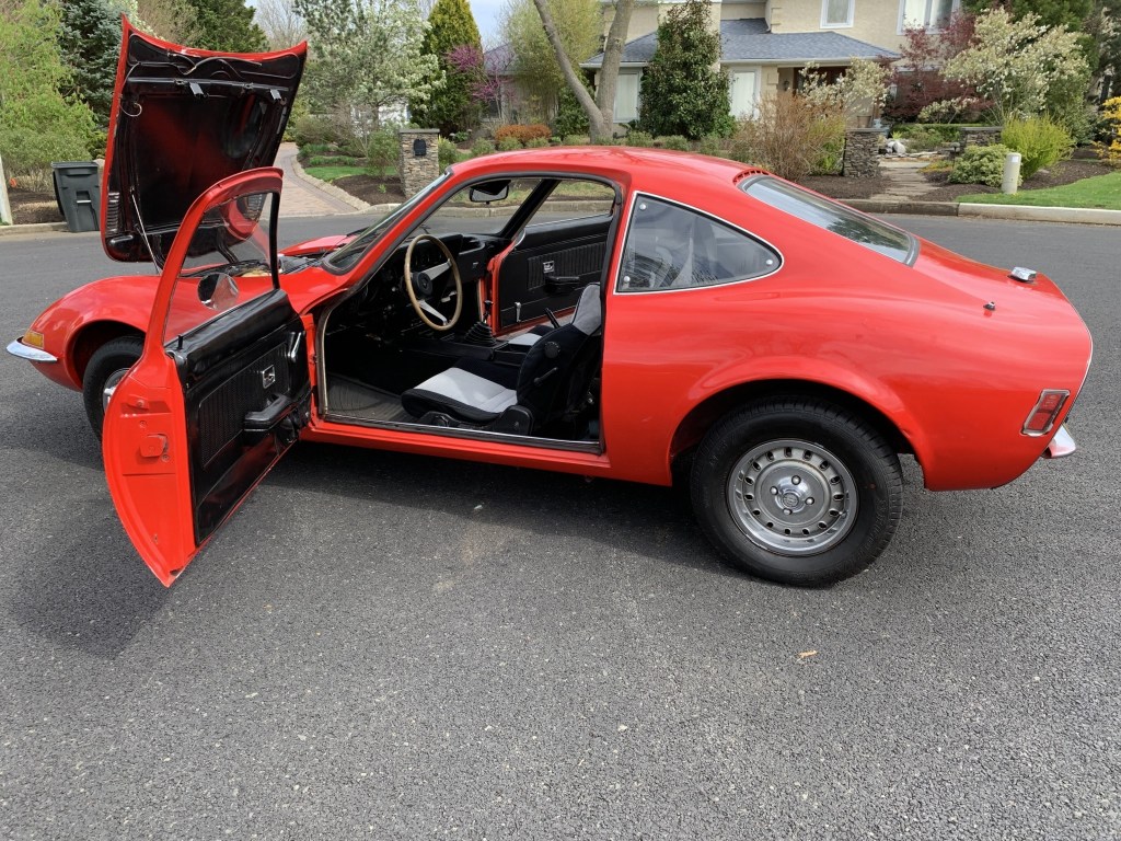 Red 1971 Opel GT with doors and engine hood open