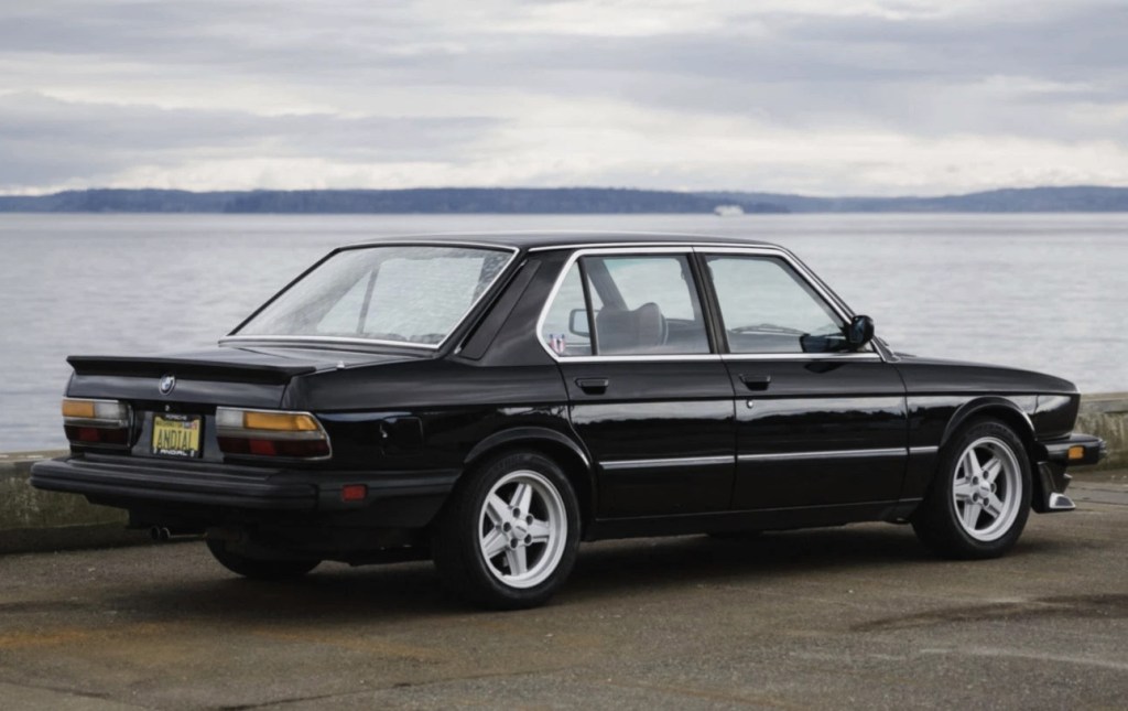 Black 1984 E28 BMW 533i sedan rear view