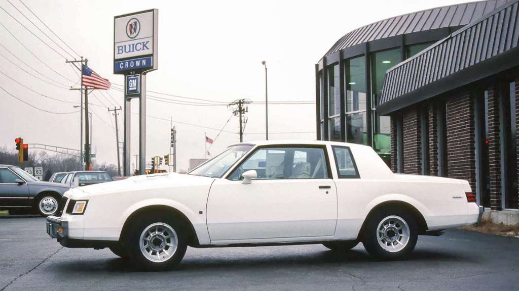A white 1987 Buick Regal T-Type parked at a Buick dealer