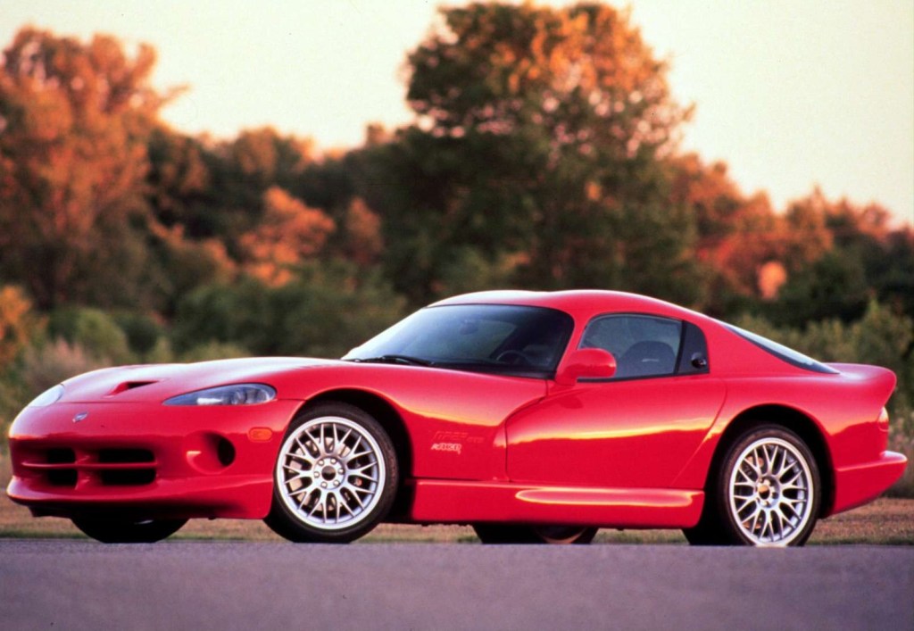 Red 1999 Dodge Viper ACR in front of trees