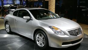 A Nissan Altima on display at an auto show