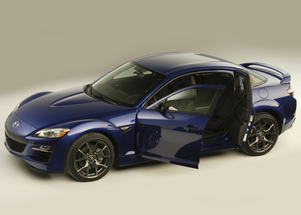 Blue 2009 Mazda RX-8 with its doors open