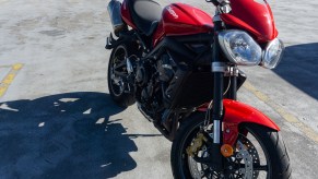 Red 2012 Triumph Street Triple R from the rider's right side