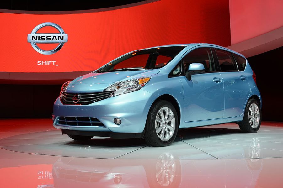 The a blue Nissan Versa on display at an auto show