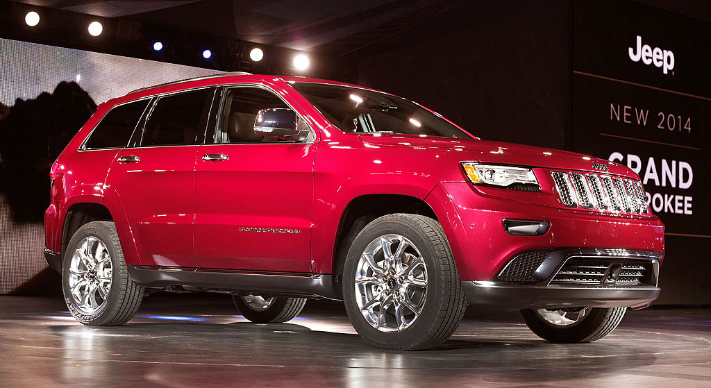 A 2014 Jeep Grand Cherokee at an auto show