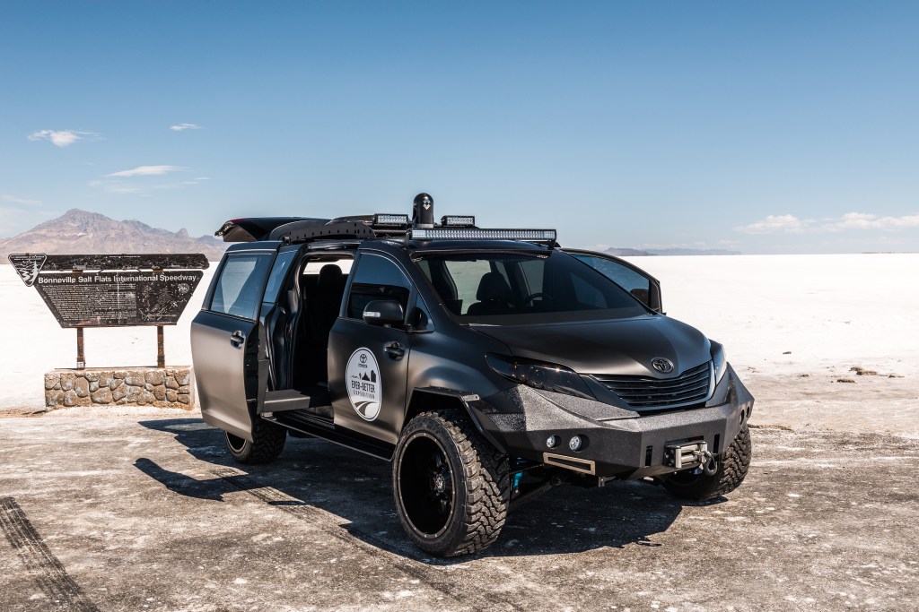 an all black overland minivan build that looks ready to take on anything