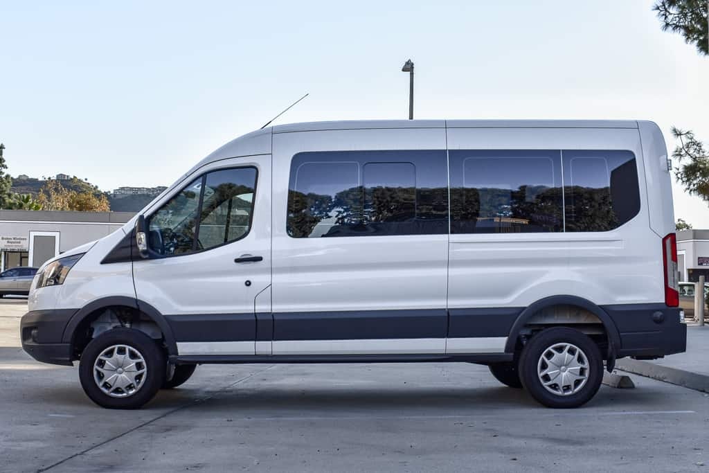 White 2018 Ford Transit equipped with Agile OffRoad's lift kit, side view