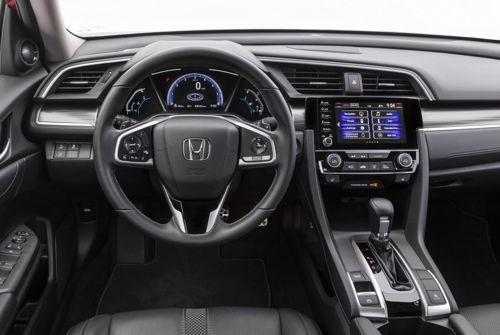 The front row of of the 2020 Honda Civic with leather-trimmed seats.
