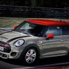 Tan 2019 Mini Cooper JCW hatchback going around a track