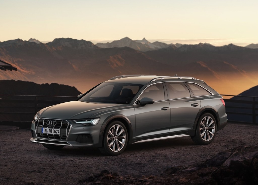 Gray 2020 Audi A6 Allroad in front of a mountain range at sunset