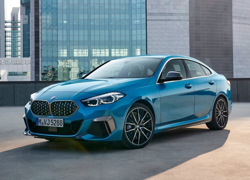Blue 2020 BMW M235i Gran Coupe parked on top of a city parking garage