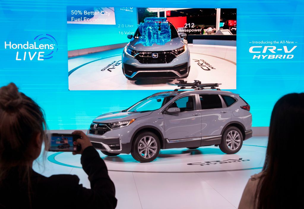A 2020 Honda CR-V Hybrid on display at an auto show