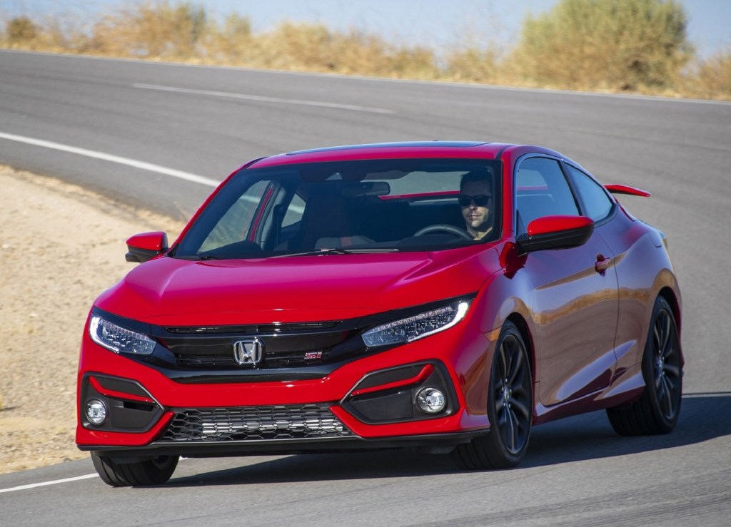 Red 2020 Honda Civic Si Coupe driving around a corner