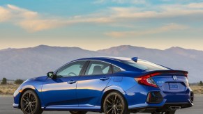 Rear side view of a blue 2020 Honda Civic Si Sedan