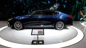 A 2020 Kia Cadenza on display at an auto show