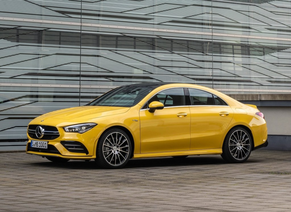 Yellow 2020 Mercedes CLA 35 AMG in front of a modernist building