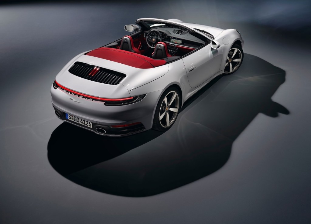 White 2020 Porsche 911 Cabriolet with red convertible top, seen from overhead
