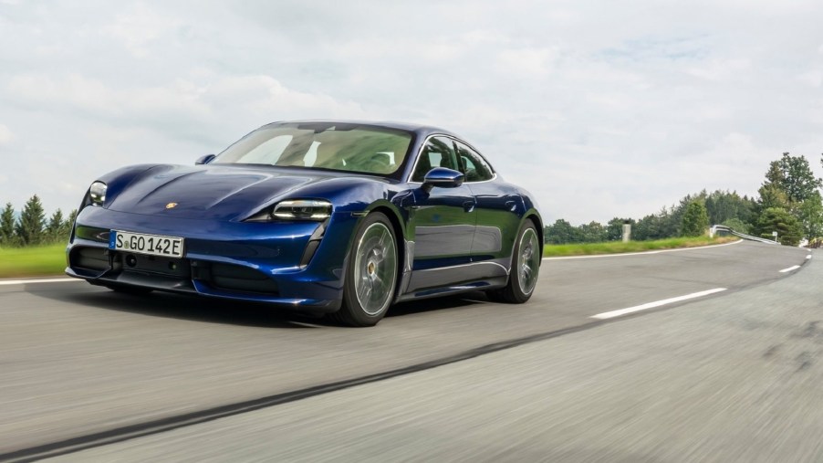 Blue 2020 Porsche Taycan Turbo driving down the road