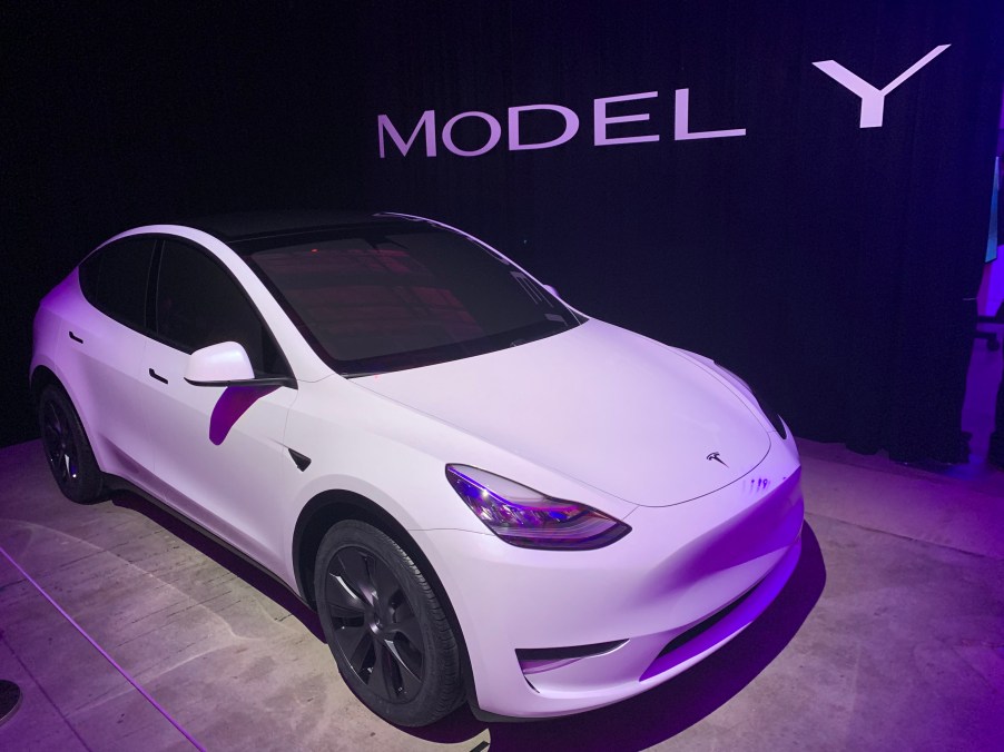 A white Model Y sits in a display