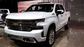 A white 2020 Chevy Silverado on display at an auto show