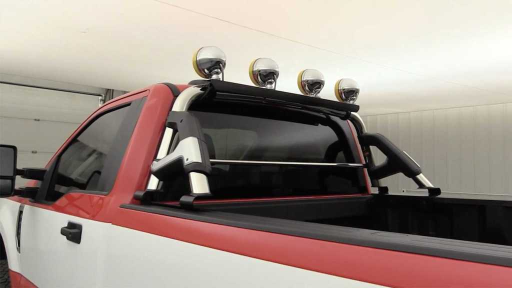 four Daylighter lamps on chrome roll bar on 2020 F250 Super Duty truck rear 3/4 view
