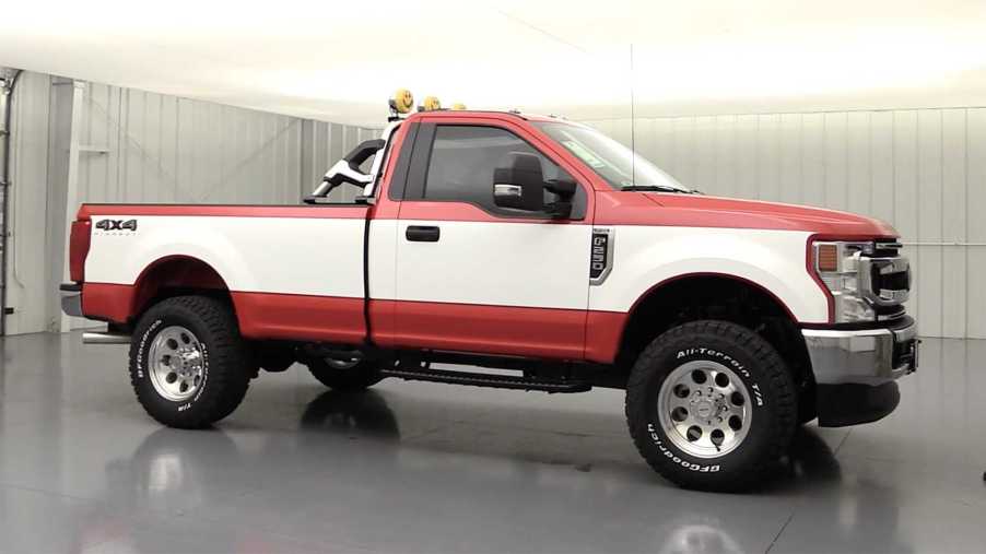 red and white 2020 F250 Super Duty highboy package side view lifted