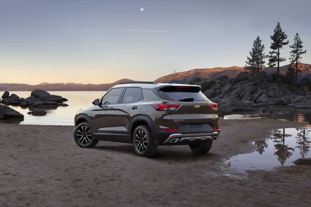 A 2021 Chevrolet Trailblazer sits on the banks of a lake at dusk.