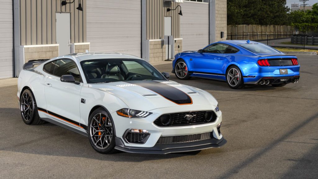 A white and a blue 2021 Mustang Mach Is