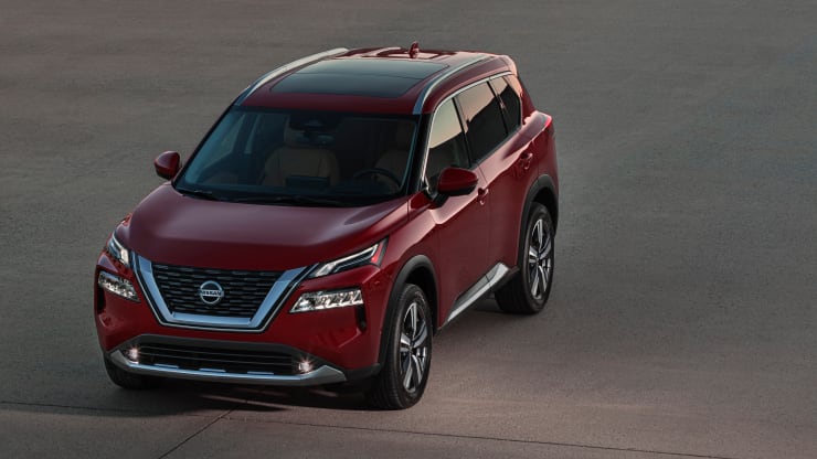 A red 2021 Nissan Rogue on the track.