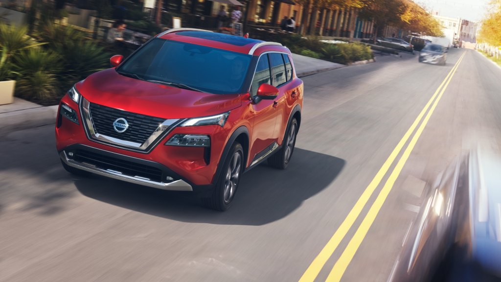 2021 Nissan Rogue in red on the street
