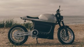 Brushed-aluminum 2021 Tarform Luna electric motorcycle on a beach