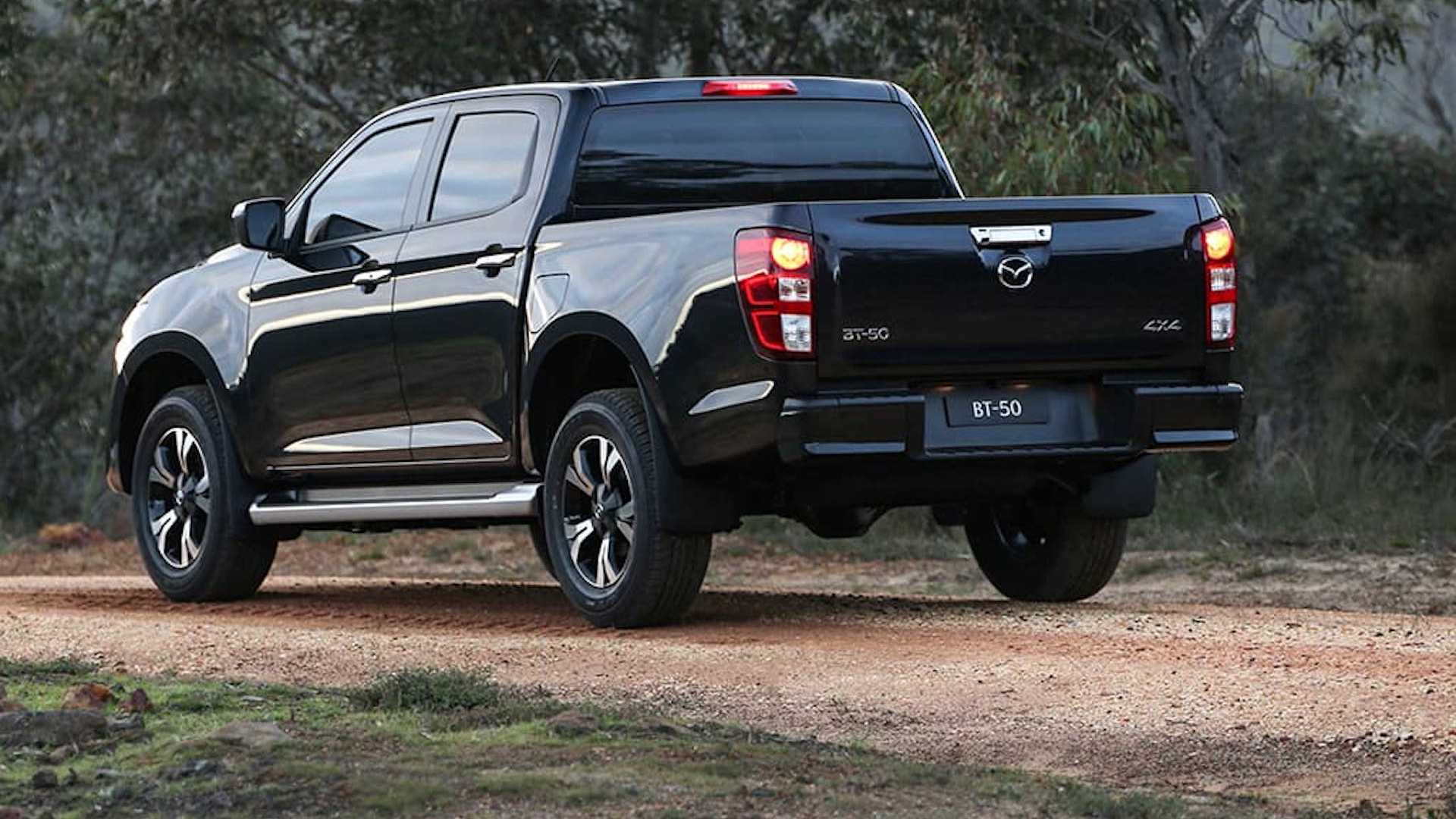 Black 2021 Mazda BT-50 pickup truck rear 3/4 view 