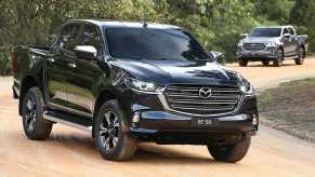 two 2021 Mazda BT-50 midsize pickup truck front 3/4 views
