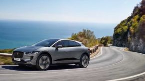 2021 Jaguar I-Pace rounding a hill on a coastline