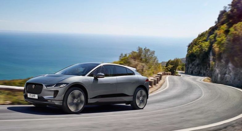 2021 Jaguar I-Pace rounding a hill on a coastline