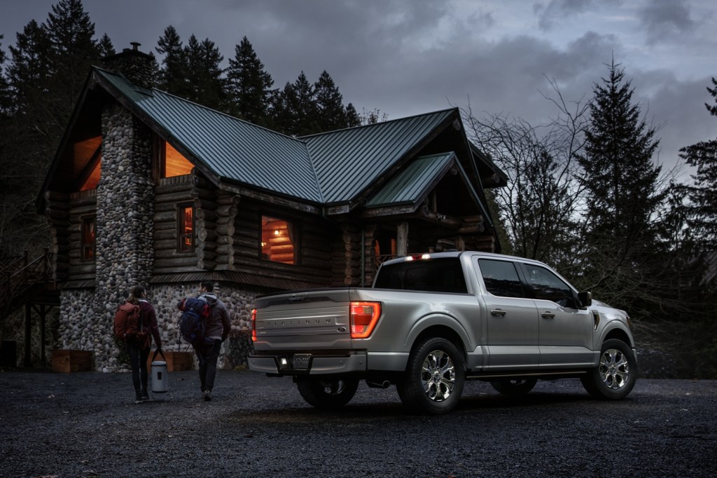 2021 Ford F-150 parked in front of cabin
