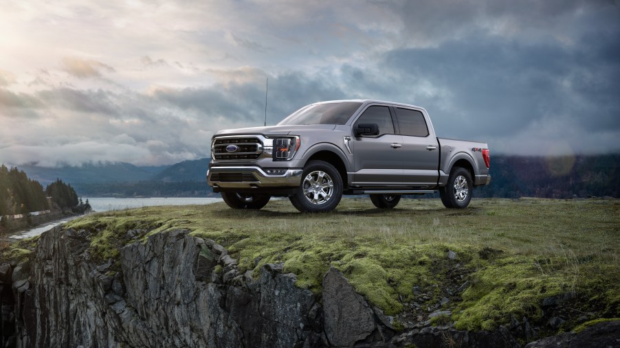 A charcoal colored 2021 F-150 sits on a cliff side.