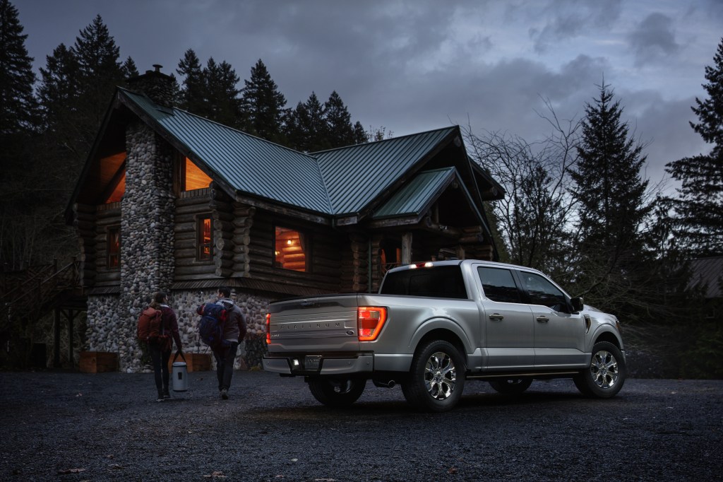 All-new F-150 Platinum Hybrid truck parked in front of house 