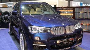 A BMW Alpina SUV on display at an auto show