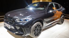 A new BMW X6 on display at an auto show