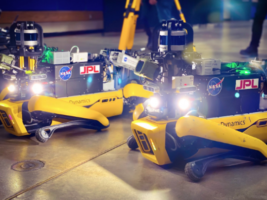 two robot dogs doing research | BD