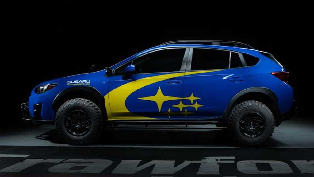 The profile of a blue Subaru Crosstrek that has been raised with a Crawford Performance lift kit