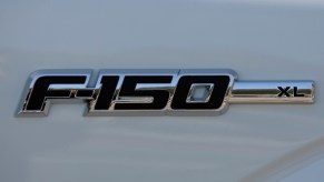 A Ford F-150 logo on a white truck