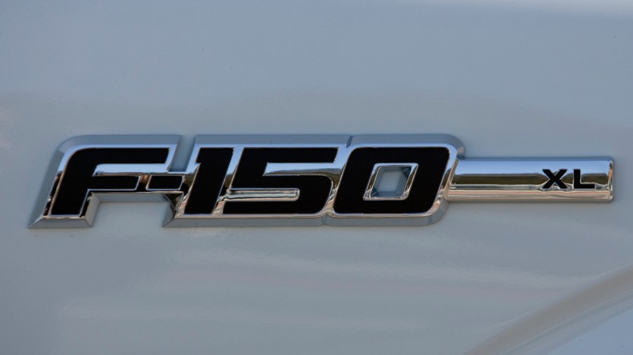A Ford F-150 logo on a white truck