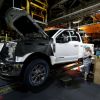 A worker builds a Ford F-250 as it goes through the assembly line at the Ford Kentucky Truck Plant
