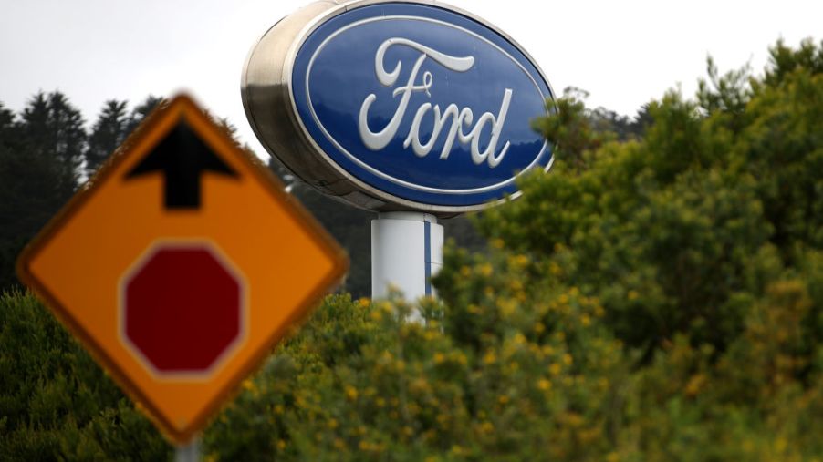 A sign with the Ford logo is posted in front of Serramonte Ford