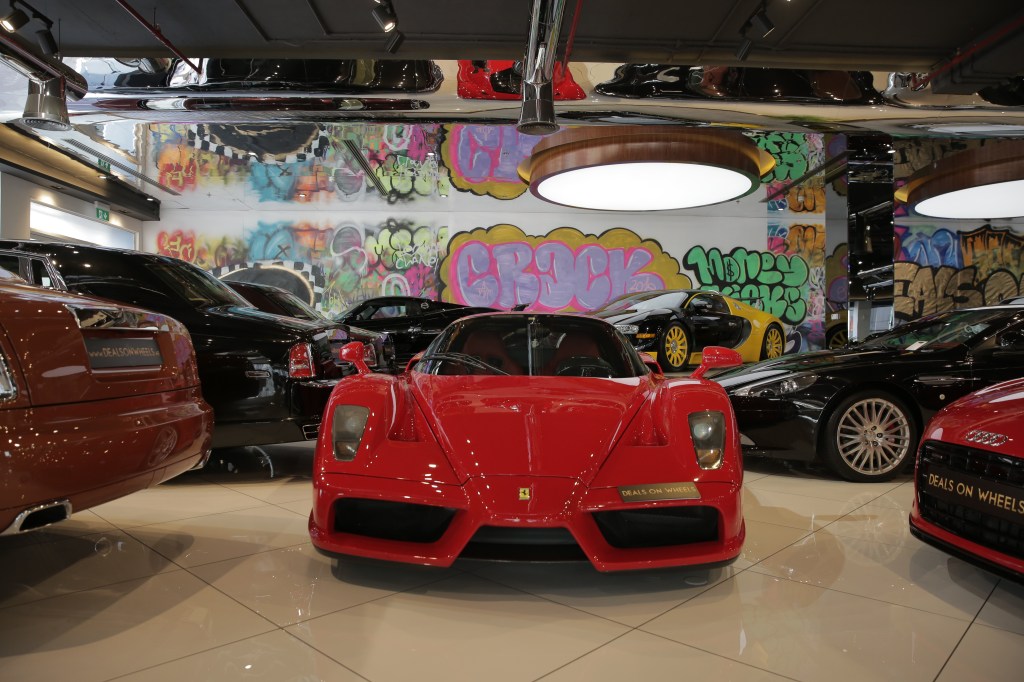 A picture looking head on at a red Ferrari Enzo