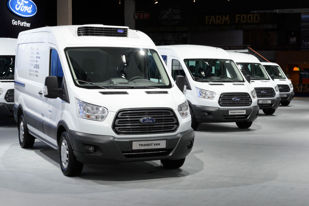 white Ford fleet vans on display