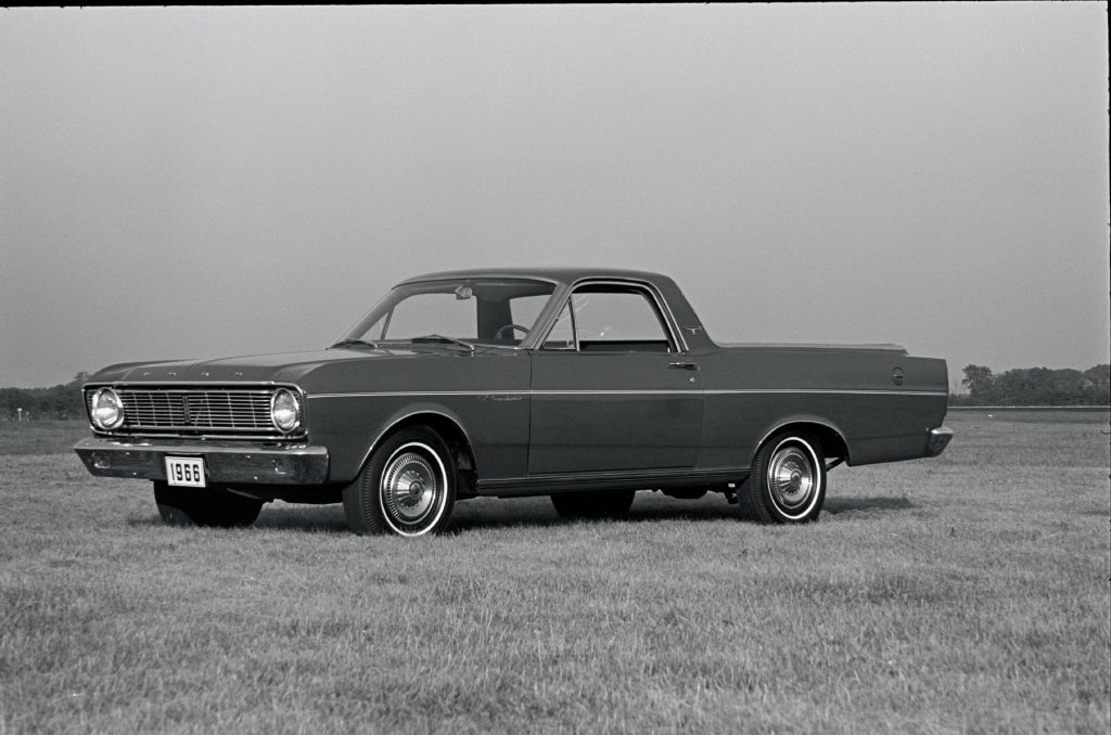 A 1966 Ford Ranchero sitting in a field